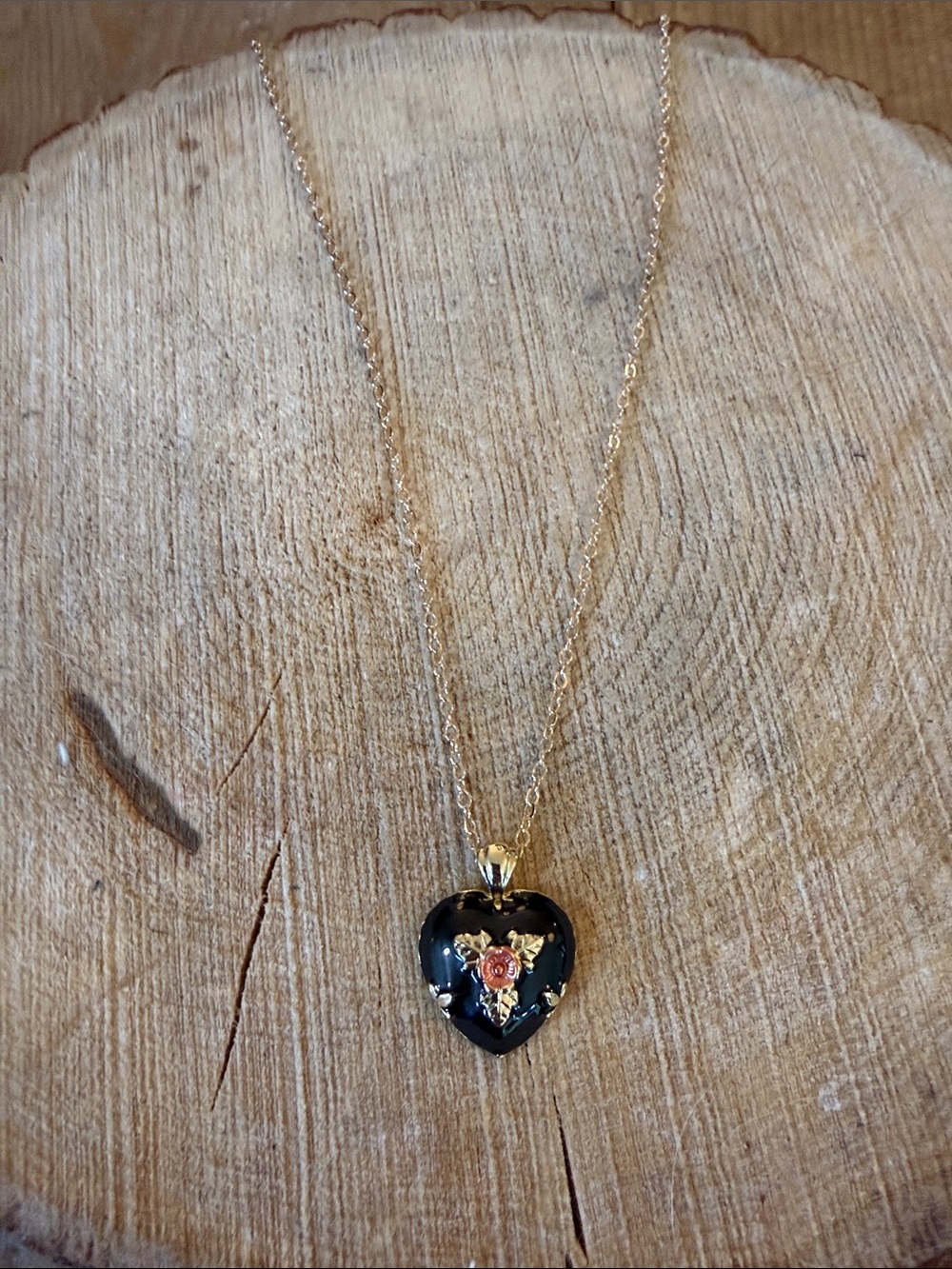 Gold-Tone Black Heart Pendant Necklace with Rose Accent